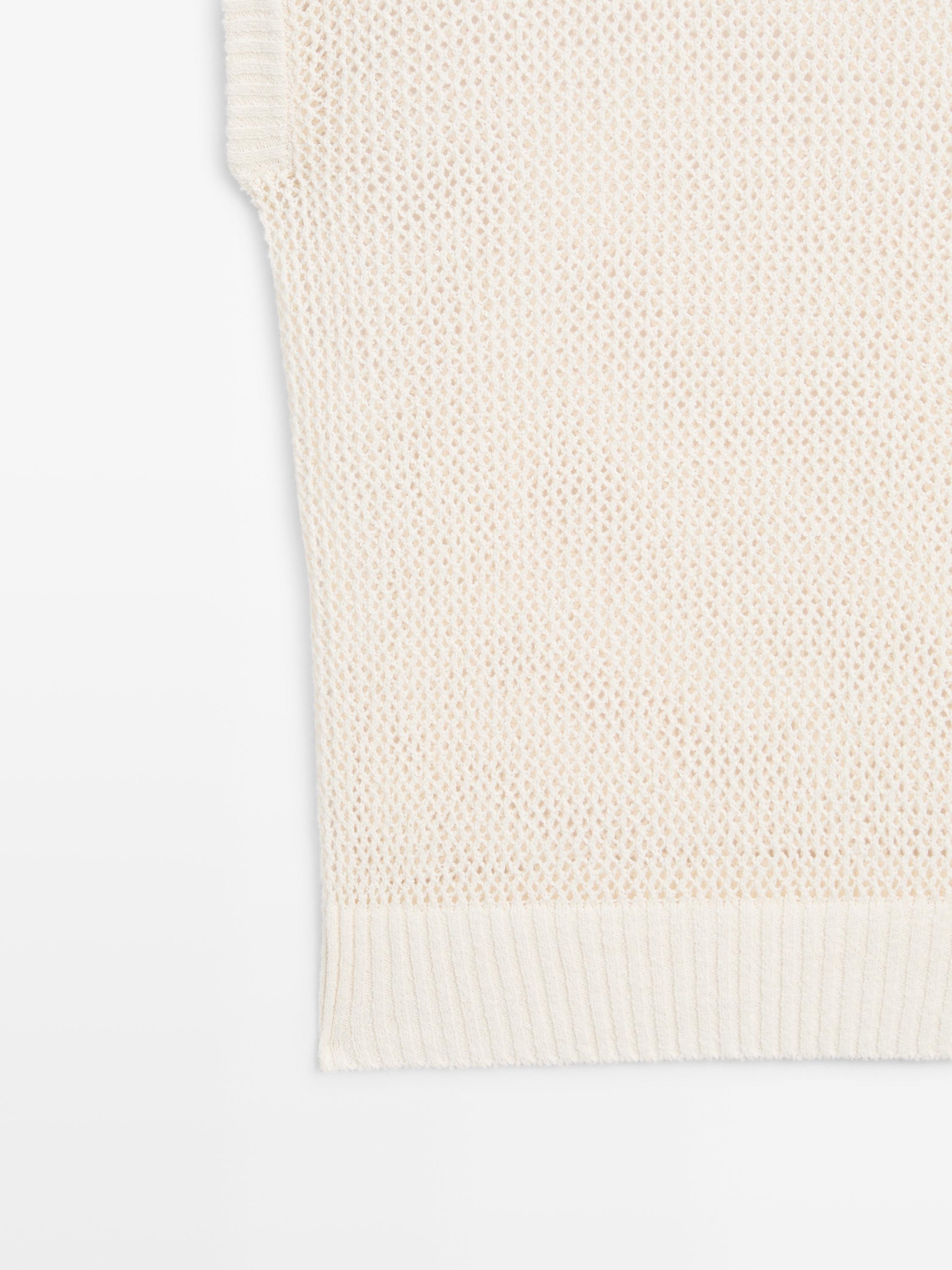 Knit top with cut-out neck